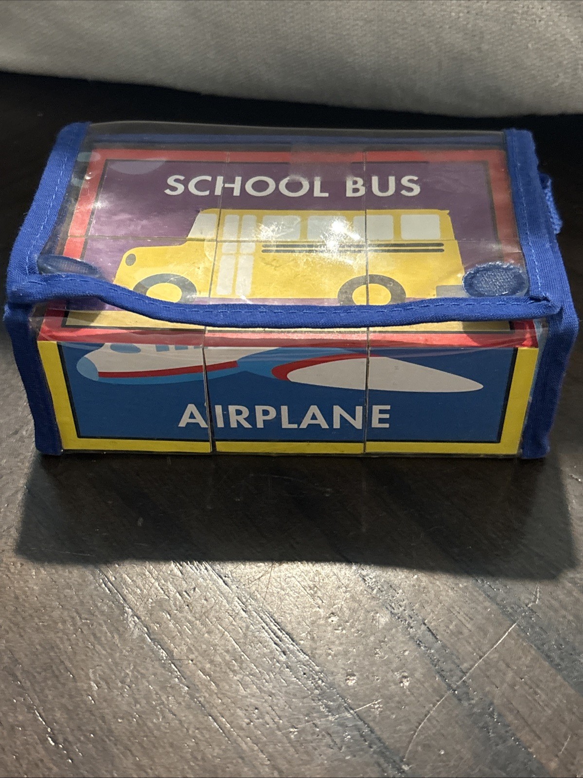 Set of children’s toy blocks packaged in a clear blue carrying case School Bus