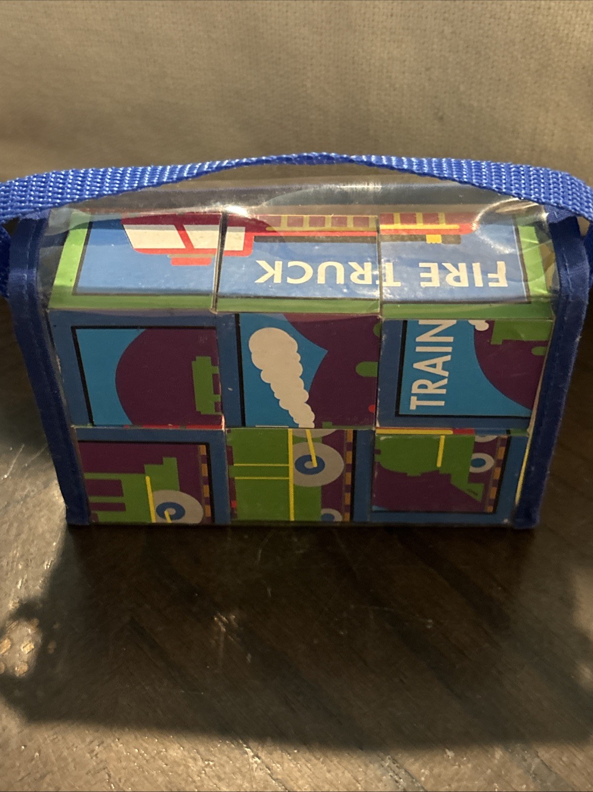 Set of children’s toy blocks packaged in a clear blue carrying case School Bus