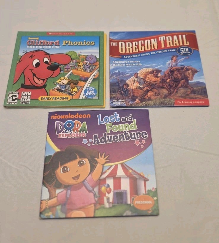 LOT OF 3 KIDS PC GAMES COMPUTER EDUCATIONAL DORA CLIFFORD OREGON TRAIL READING