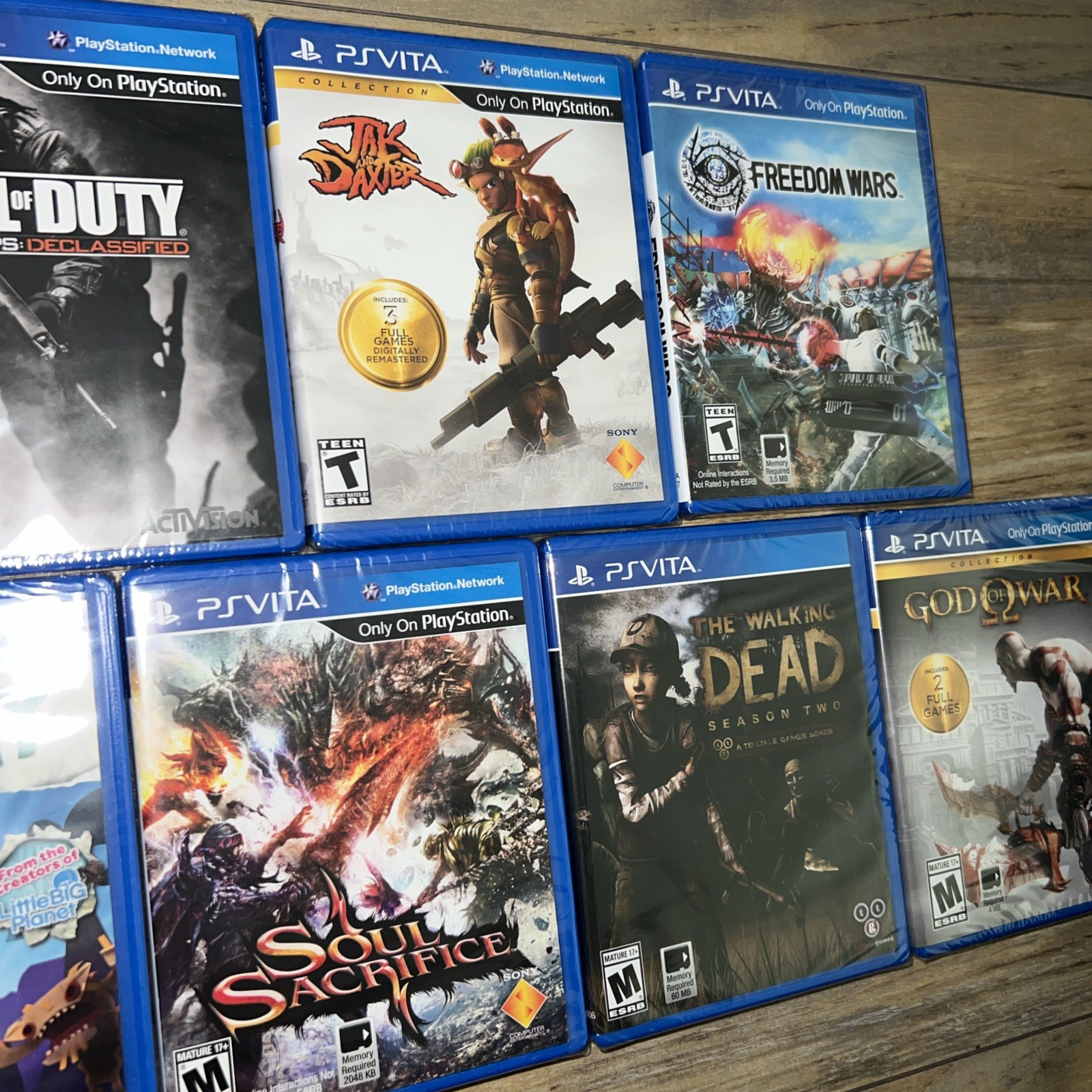 PlayStation Vita Games Lot of 7 ( God of War, Tearaway, Walking Dead, COD, Jak)