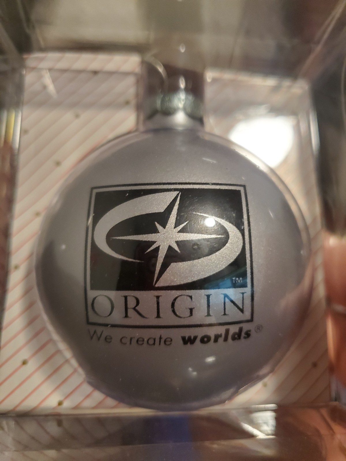 ORIGIN SYSTEMS GLOBE HOLIDAY ORNAMENT – SILVER WITH ”WE CREATE WORLDS” TAG/LOGO